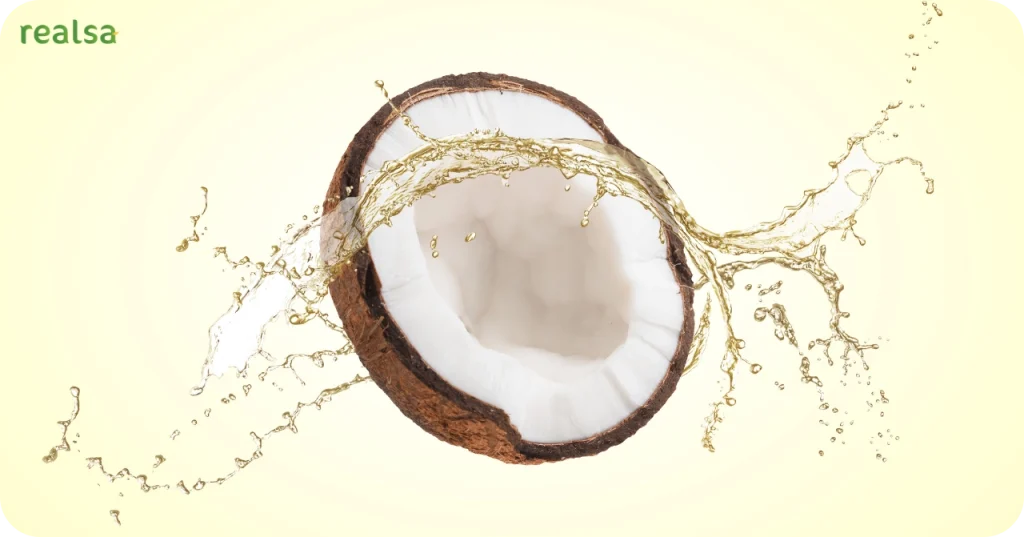 Dynamic splash of pure Virgin Coconut Oil surrounding a fresh coconut half, representing Realsa Exporter Indonesia's premium quality